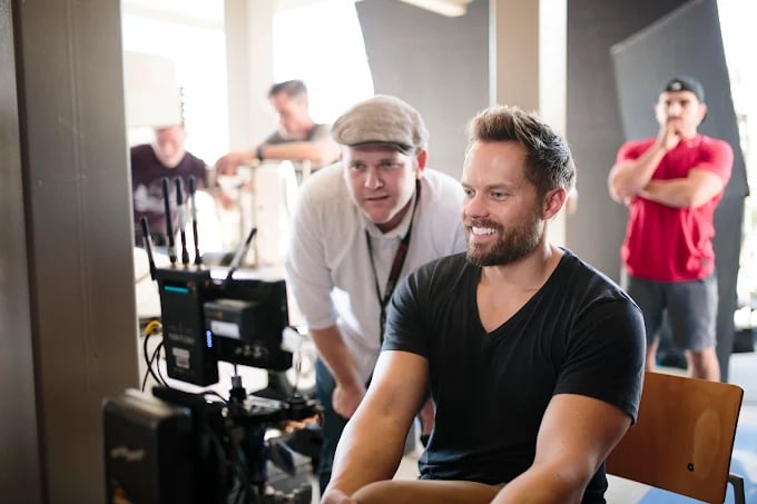 Film crew members working behind the scenes on a production set